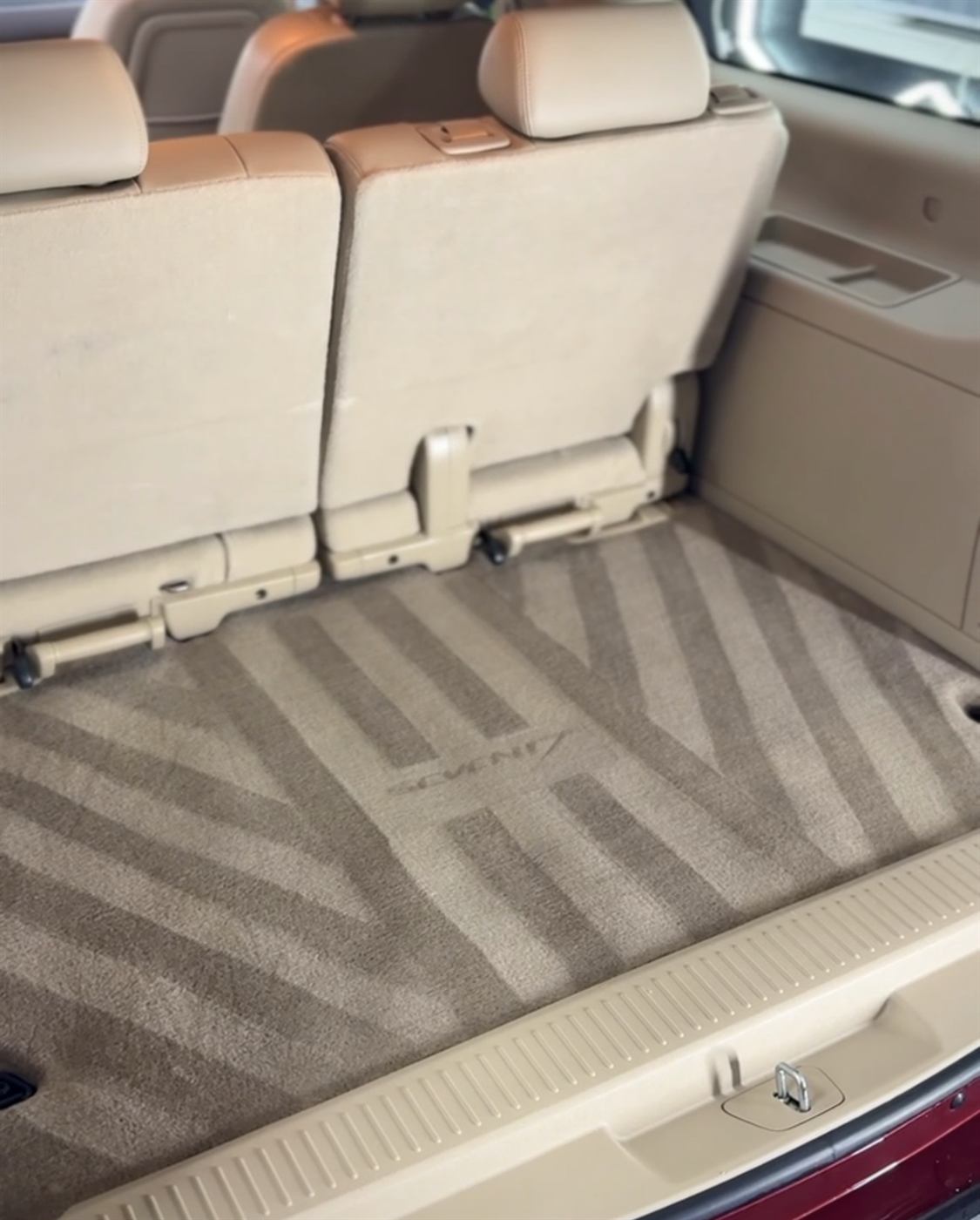 Vacuumed cargo area with the Seven17 mark pattern shaved into the carpet